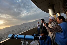 A group are trying to find a new moon from the top of Milad Tower in Tehran at the end of Ramadan, 1433/2012.