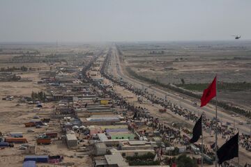 The route between Najaf and Karbala, 2015. Mawakibs on the left of the road provide free food and resting place for the pilgrims.